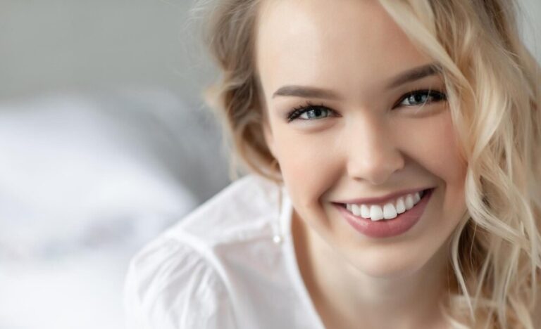 Young woman smiling outdoors