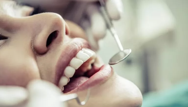 Dentists treating patient’s teeth