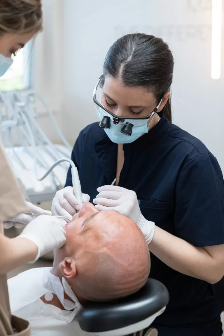 Dentist performing dental procedure