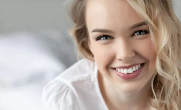 Young woman smiling outdoors